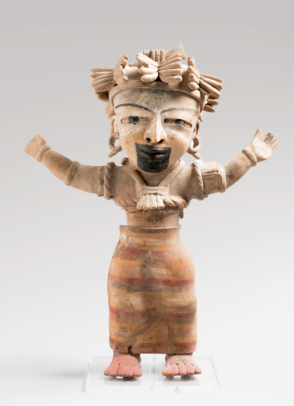 2 Figure of dancer with pastillaje headdress, 23 in. (58 cm) in height, earthenware, red on cream slip, asphalt paint, Mexico, Veracruz, on view at the Gardiner Museum. Gift of George and Helen Gardiner. 