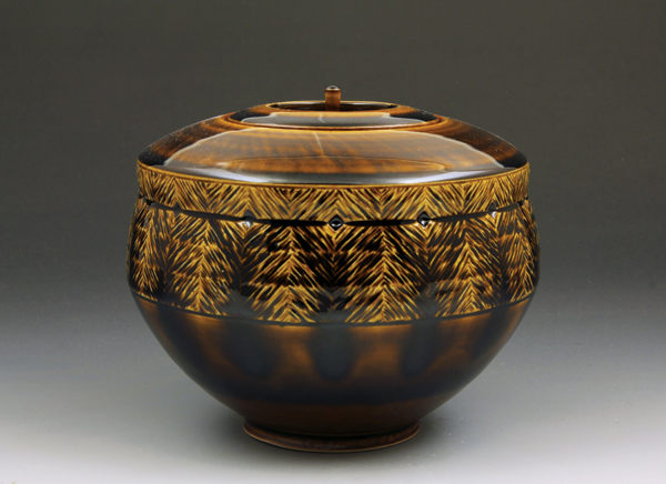 9 Lidded jar, 6¾ in. (17 cm) in diameter, porcelain, molasses glaze, fired to cone 10 in reduction, 2017.