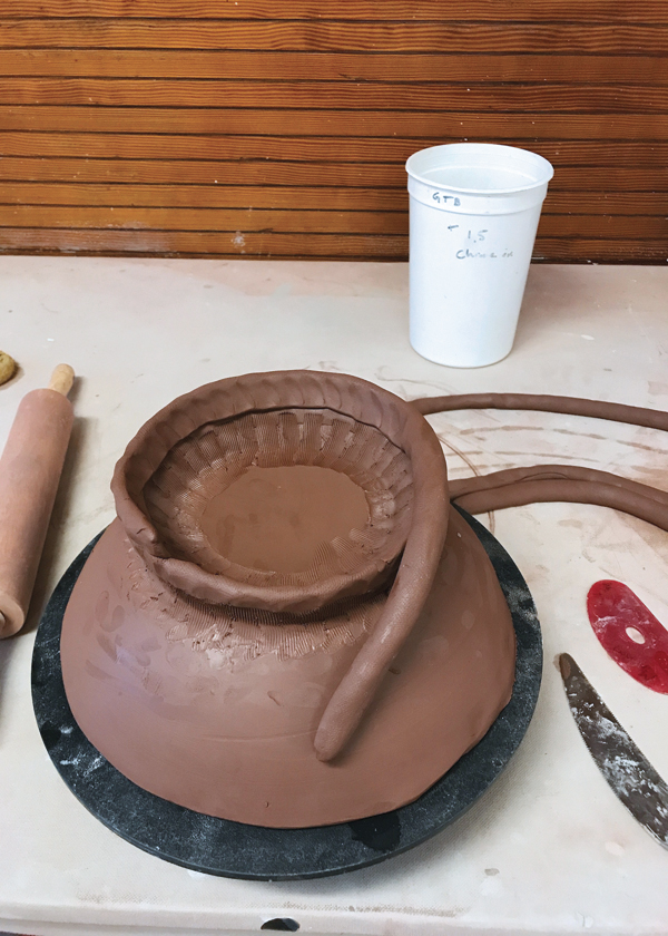 1 Drape a slab over a bisque mold and build a foot using coils.