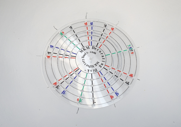 3 An MKM Decorating Disk helps to divide the area into desired number of sections.