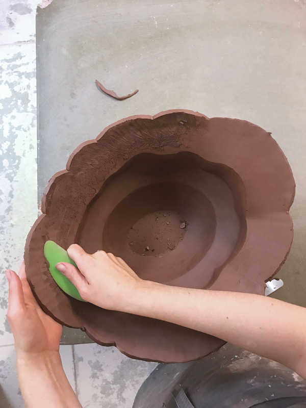 4 Scrape the coils together, then use a rib to smooth the interior and exterior walls.