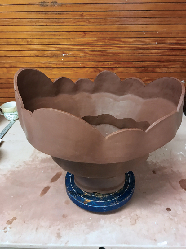 6 Cut each section in an uneven scalloped pattern to create an asymmetrical shape.