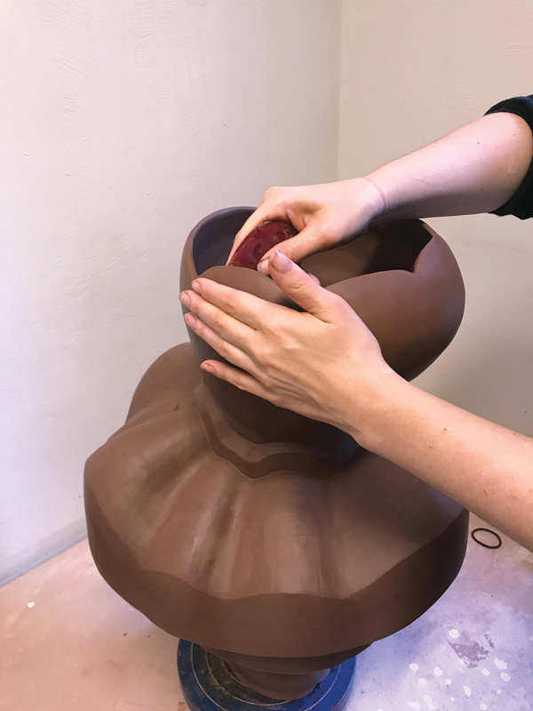 8 Begin the finishing touches, smoothing the rim and the walls with a soft rib.