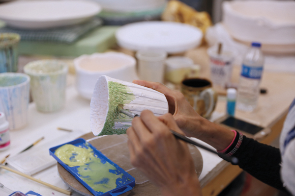 10 After the bisque firing, add underglaze colors without overlapping them.