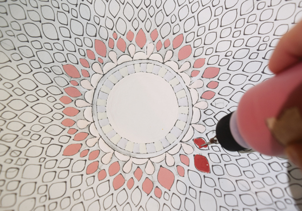 11 Begin adding color glazes in a circular pattern.