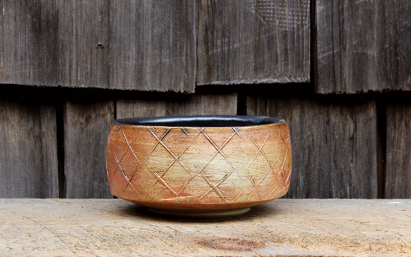 5 Matthew Krousey’s paddled bowl, wheel-thrown and altered stoneware, glazed and fired in a salt kiln.