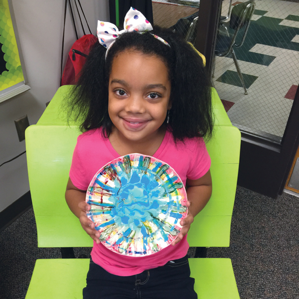 7 Arajay Dagins with her decorated plate. Photos: Jesse Ross.