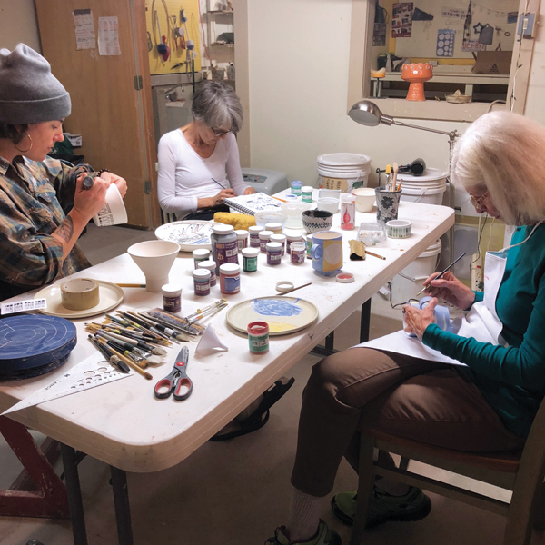 3 Artists Zoë Doucette, Alison Kolesar, and Jane Hudson (left to right) at work in Stephanie Boyd’s studio.
