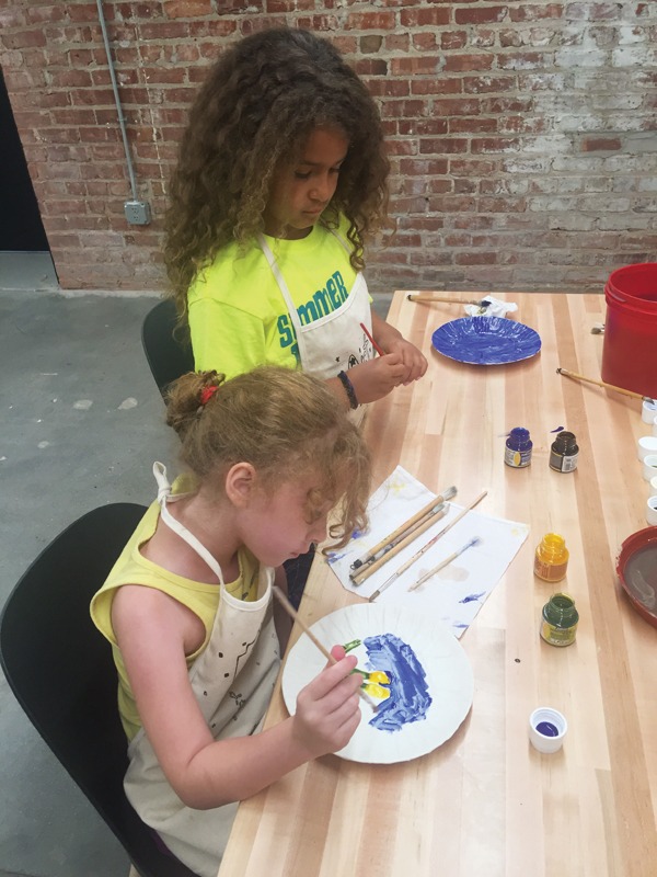 2 Plate Project workshop at the Union for Contemporary Art in preparation for National Clay Week; Nevaeh Kocarik and Mara Johnson working on their plates. 