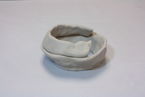 5 When building a form with a steep inward angle, attach triangular coils at the thicker ends.