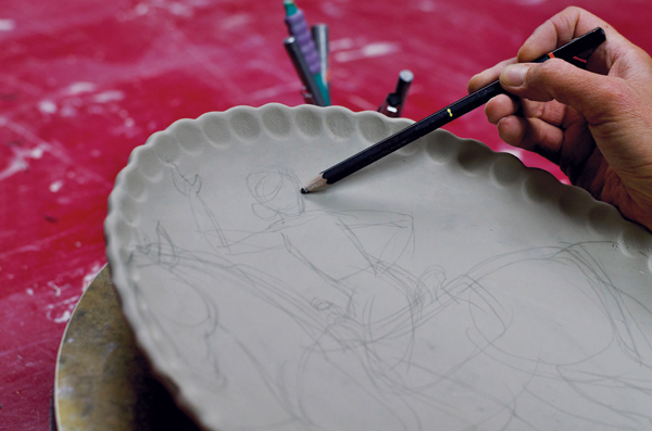 1 Lightly sketching the design and composition.