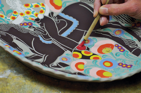 5 Embellishing the figure with small areas of added underglaze color and pattern to reinforce the idea of a rodeo queen’s showy appearance.