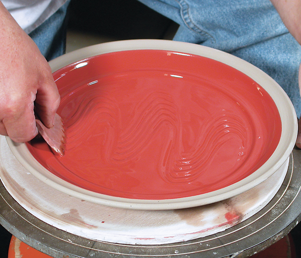 8 Combing through a single-colored, fluid slip to create a surface pattern.