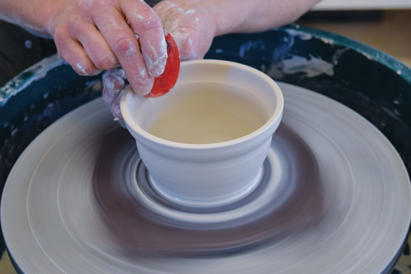 1 Throw a bowl and use a small rib to create a gallery at the rim. Trim excess clay from the base, then measure the gallery.