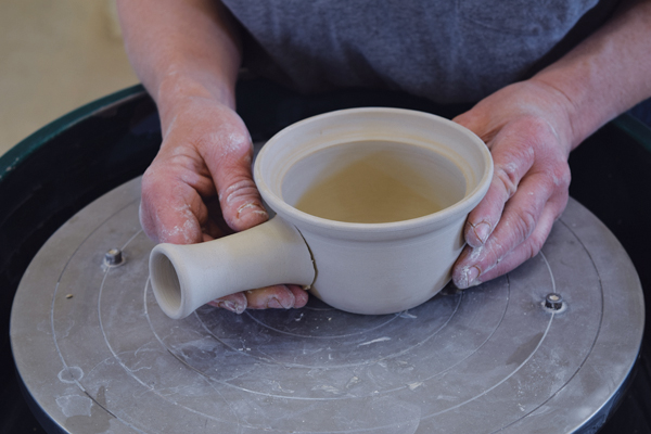 8 Try the handle on for fit, then draw around the handle with a needle tool. Score and slip and attach the handle.