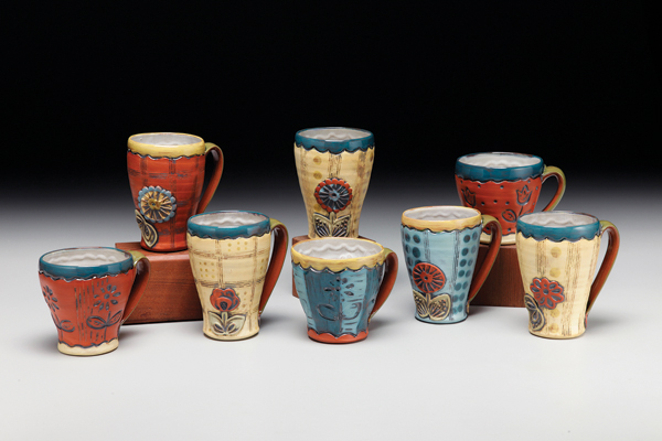 Mugs, to 6 in. (15 cm) in height, red earthenware, terra sigillata, glaze, patina, 2017. Photo: Tim Barnwell.