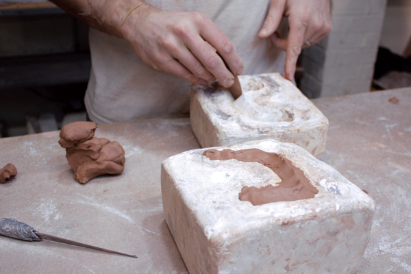 13 Pack clay into the handle mold and join the two halves.