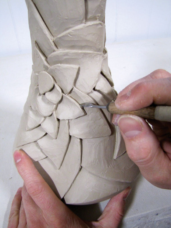 13 After carving to create dimension and the illusion of layered petals, carve under the edges of the petals using the Kemper tool.