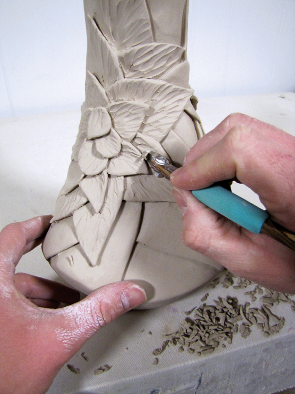15 When the piece is leather hard, add carved texture to the surface of the petals using a Zebra carving tool.
