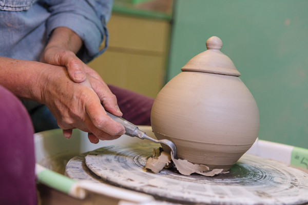 4 Trim clay from the base right after it’s thrown or wait until the pot is leather hard and trim it upside down.