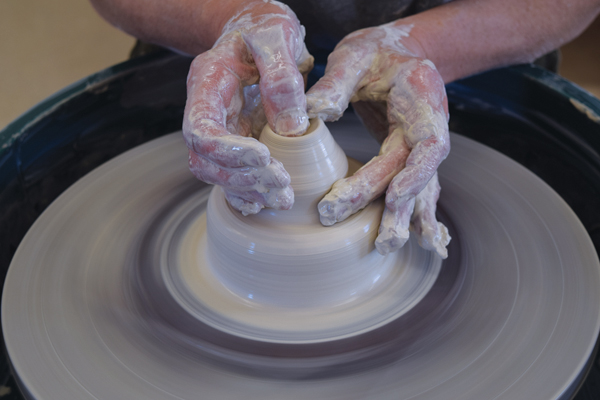 2 Center 1½ pounds of clay, make a groove toward the top, then open up the clay almost to the level of the groove.
