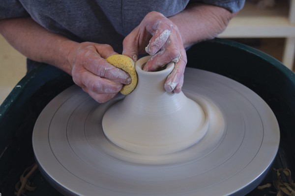 8 Pull and thin the remaining clay to form the knob.