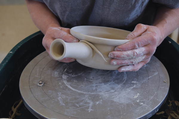 11 Score and slip both surfaces, then attach the handle to the baker. You may need a tiny coil around the top half of the handle to make the attachment smooth and secure.