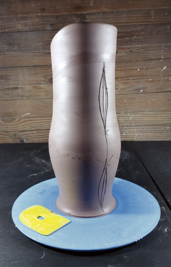 3 Continue to sketch proportions and dart placements around the pitcher (front view).