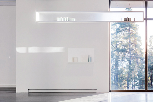 1 Edmund de Waal’s Atmosphere (part), 9 ft. 8 in. (3 m) in length, 286 porcelain vessels, 9 suspended aluminum and Plexiglas vitrines, 2014. Background: Edmund de Waal’s Vita Silente I, 3 ft. 6 in. (1.1 m) in width, 5 porcelain vessels, 3 alabaster blocks, aluminum shelf, 2017. Photo: Jean-Baptiste Beranger, Artipelag.