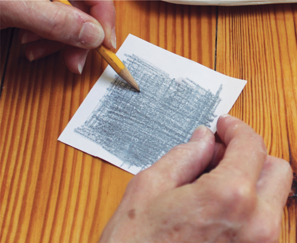 7 Use a graphite pencil to blacken the back of the paper that the image is printed on.