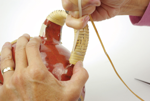 11 Crank the 5 wraps with your hand to tighten, then pull the wrapping strand up through the wraps.
