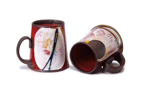 22 Naomi Clement’s mug pair, to 4½ in. (11 cm) in height, handbuilt stoneware, underglaze, 2018. Photo: Steven Krause.