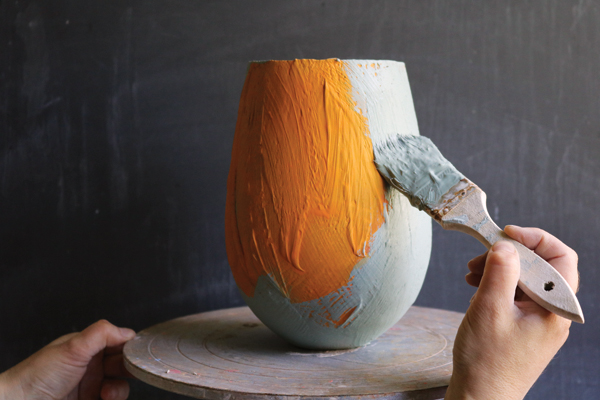 7 Next, apply turquoise blue (Spectrum stain) slip over the underglazed surface.