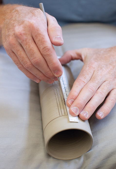 10 With your piece set on foam or a pillow, draw vertical lines into the sections.