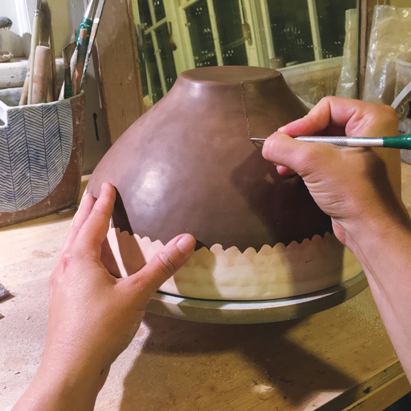 11 Using a needle tool or similar sharp-tipped object, scratch lines through the waxed surface to be inlaid later.