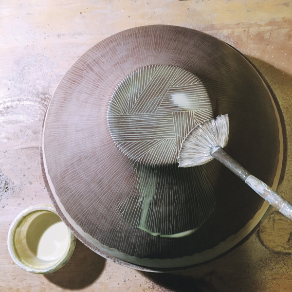 12 Brush stained, diluted slip into the lines scratched into the waxed surface.