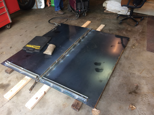 3 The 16-gauge mild-steel roof plate. Since the material does not come in a width that would span the kiln, two equal sections were used and the joint is at the center of the kiln’s width. A section of Super Strut was skip welded along the length of the seam.