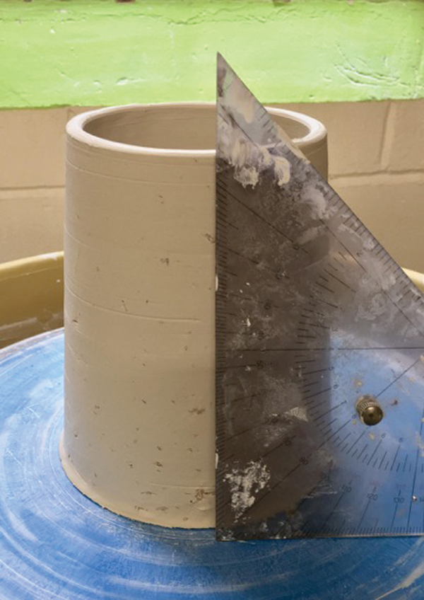 4 Use a triangle as a guide to make marks for altering the cylinder.