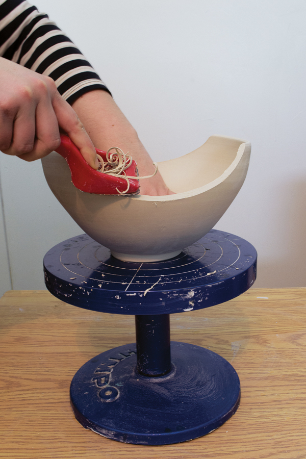 3 Use a curved Surform to make sure the cut is even and to round off the cut edges.