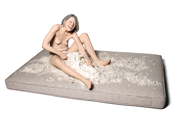 4 Tantrum (alternate view), 5 ft. 6 in. (1.7 m) in length, stoneware clay, paint, chalk pastel, synthetic hair, mattress, 2017.
