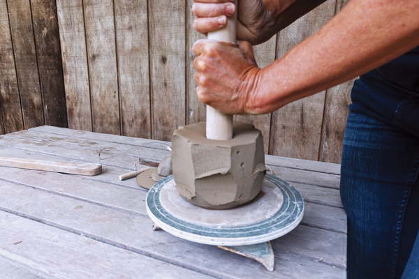 3 Create an opening in the bowl by pushing down into the center with a dowel.
