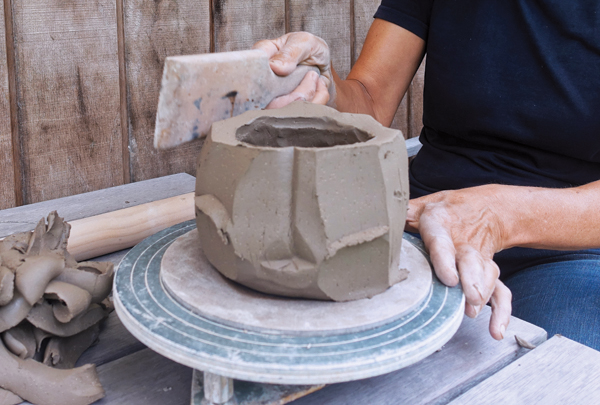 5 Shape the bowl again, this time using a paddle.