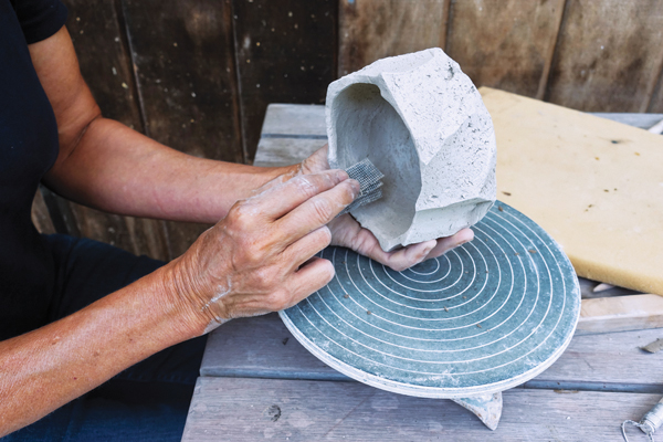 9 When the bowl is dry, sand the inside of the bowl to smooth out some of the carving marks.