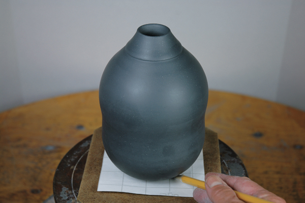 10 Trace the contour of the base onto sturdy paper to create a paper resist.