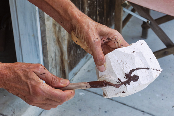 10 Decorate the bowl with red iron oxide slip.
