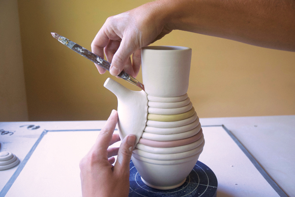 15 Use the sharp tip of a rubber shaping tool to refine the seams.