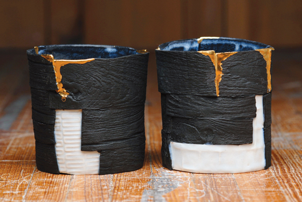2 Bryan Hopkins’ black cups, 3½ in. (9 cm) in height, handbuilt porcelain, underglaze, glaze, luster, 2018. 