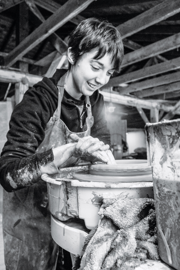Christina Bendo throwing Watershed clay on the wheel. Photo: Claire Brassil.