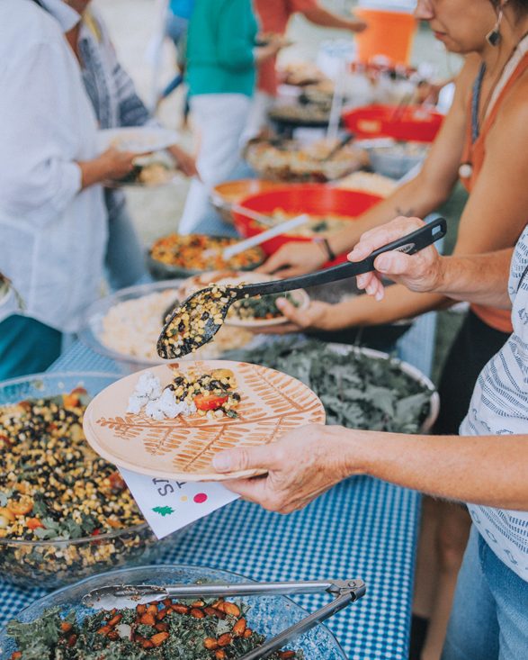 Filling up plates at the salad buffet.