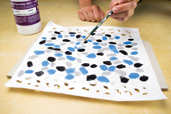 2 Paint three layers of underglaze on each shape for opacity in the colors.